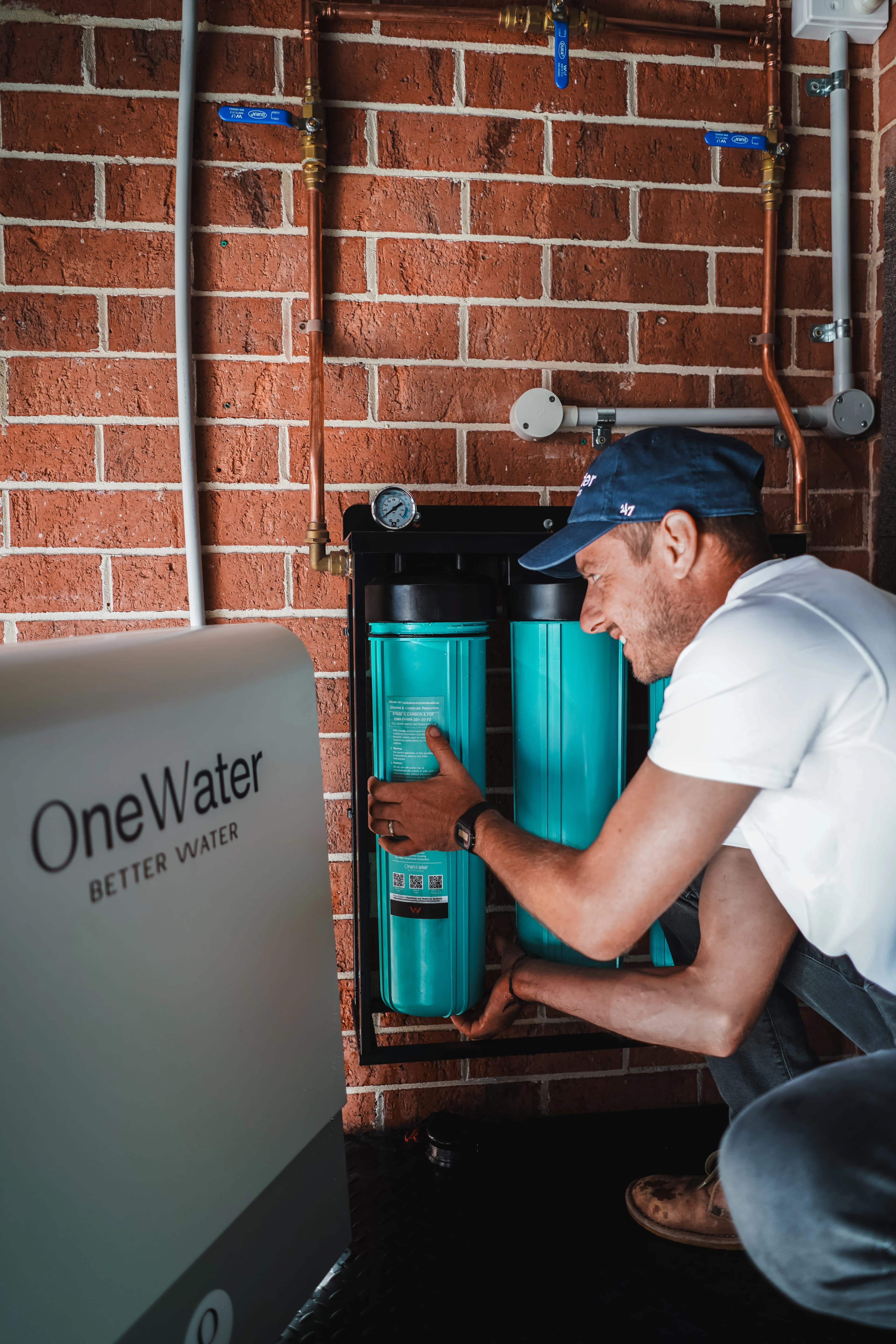Technician installing a OneWater filtration system