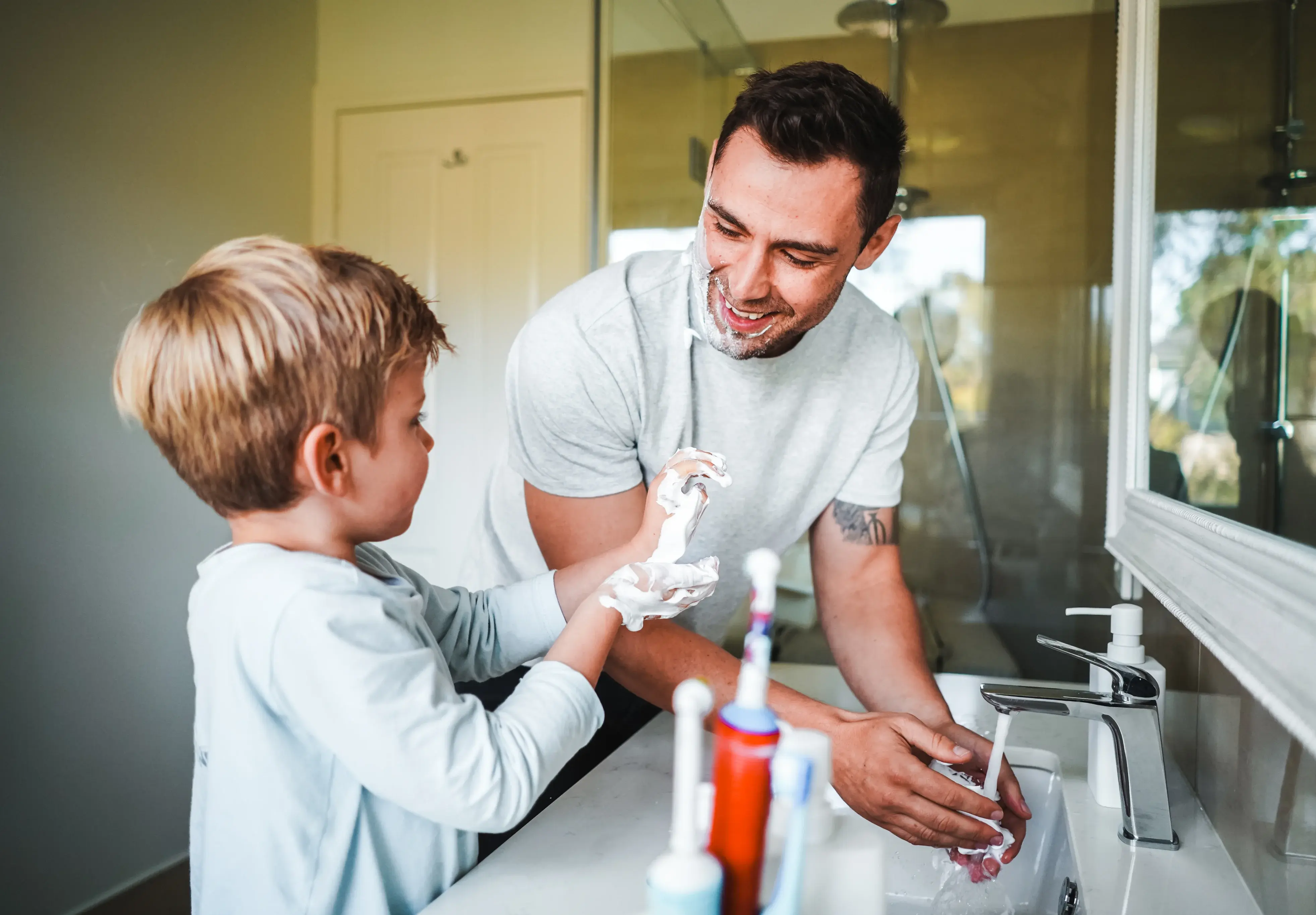 Parent and child washing hands