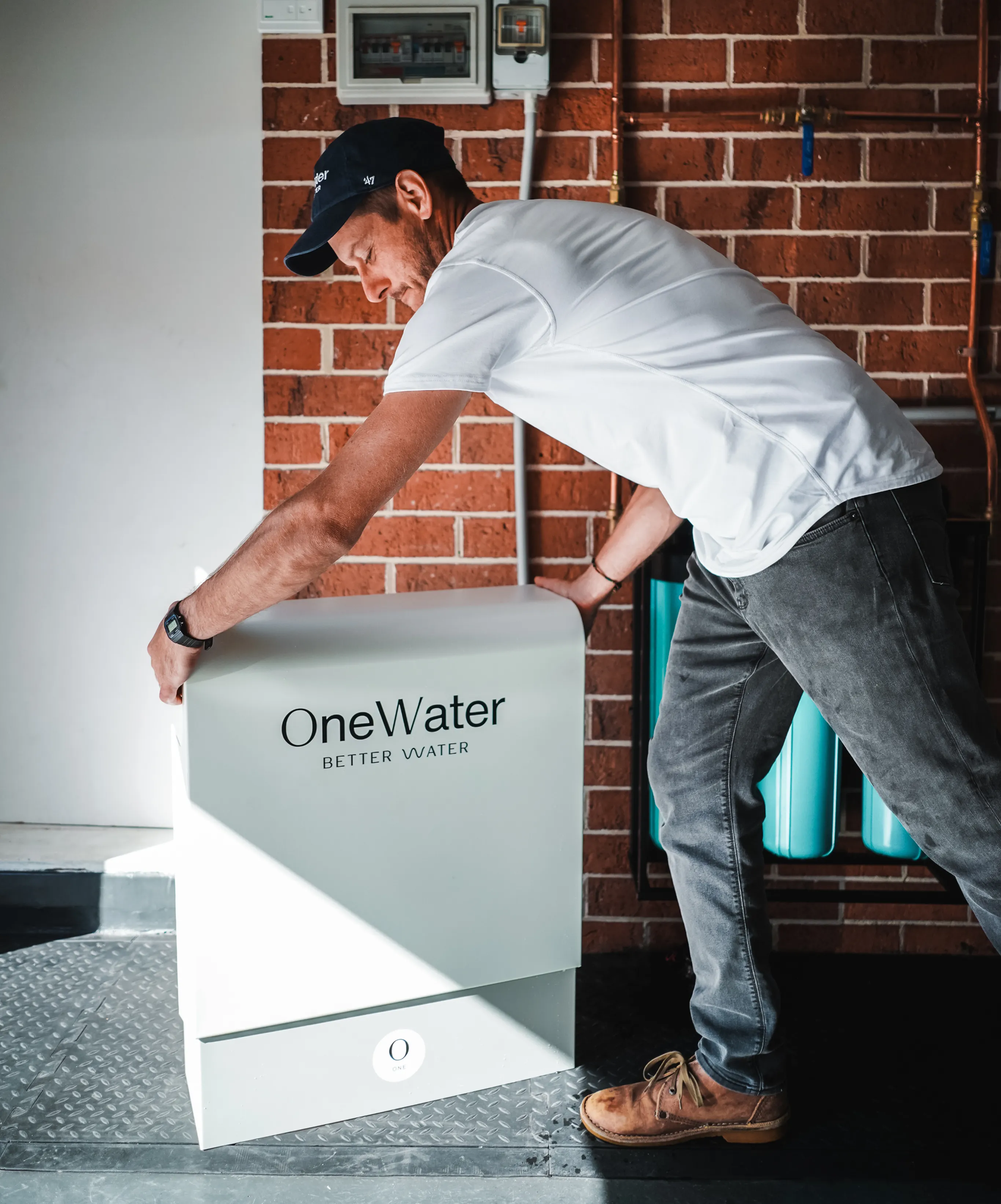OneWater installer setting up a home filtration system
