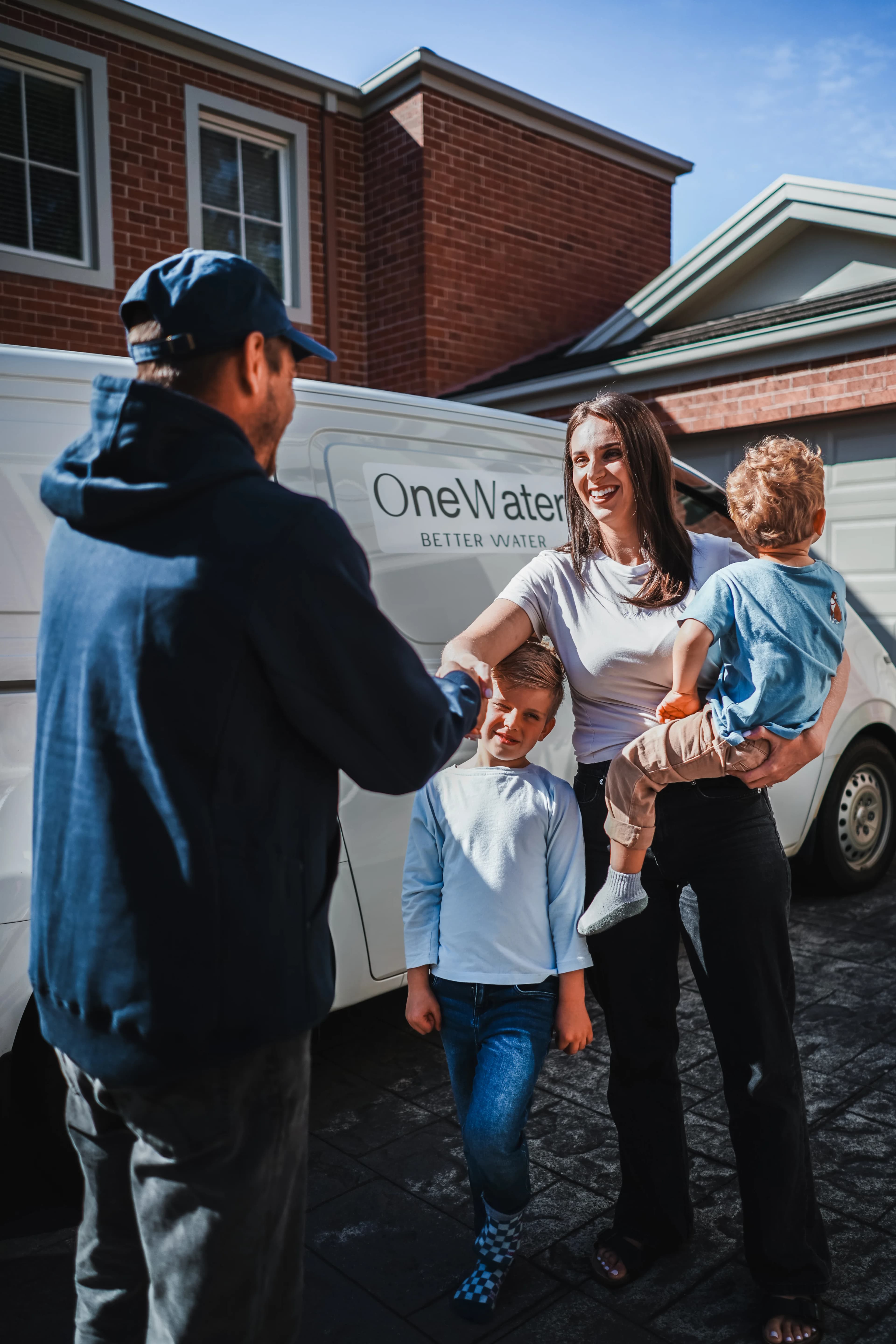 OneWater team consulting with an Australian family about their water quality
